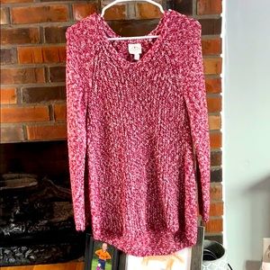 Long knit sweater, longer in the back.